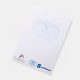 A5 notepad featuring white pages with a subtle blue design and branding logos at the bottom.