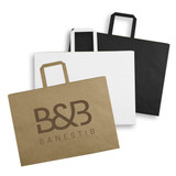 Three extra large flat handle paper bags in brown, white, and black, with a logo on the brown bag.
