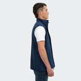A navy vest for men featuring a high collar and a side zip, displayed on a model in profile.