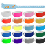 A collection of 25mm vinyl wristbands in various colours, featuring a logo on one band.