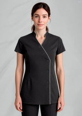 A black women's crossover tunic with short sleeves and white piping details, featuring a button closure.