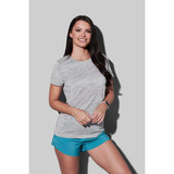 A woman wearing a grey marled T-shirt paired with blue shorts, with a logo visible on the shirt.