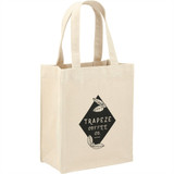 A mini cotton tote bag in a natural beige colour with black branding and two sturdy handles.