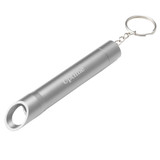 A silver drink bottle opener keychain with a cylindrical design and circular opening. The keychain has a branding logo.
