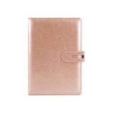 A rose gold PU notebook with a smooth finish and a clasp closure. Features a logo on the front.