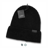 A black knitted beanie with a folded cuff and a tag attached, featuring a branding label.
