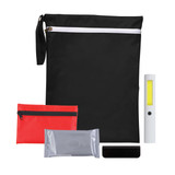 A black pouch containing a flashlight, a red pouch, a silver packet, and a black object.