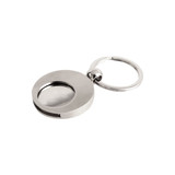 A metallic round keyring featuring a coin holder, with a smooth finish and a circular design.