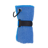 A blue travel towel rolled and secured with a black strap and a carabiner attached, featuring a textured surface.