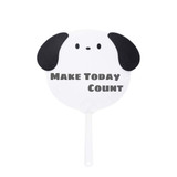 A custom-shaped hand fan in the design of a dog’s face, featuring black ears and a white body.