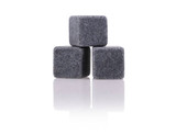 A set of three grey granite drink stones, designed for chilling beverages without dilution.