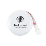 A white tape measure with a circular casing and a retractable measuring tape. It features a logo.