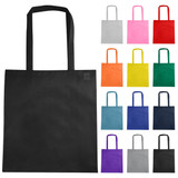 A black non-woven reusable grocery bag with long handles, surrounded by various coloured bags.