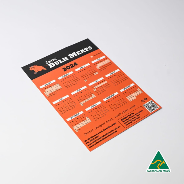 A magnetic calendar for 2024 featuring a bold orange design and a logo, with various monthly layouts.