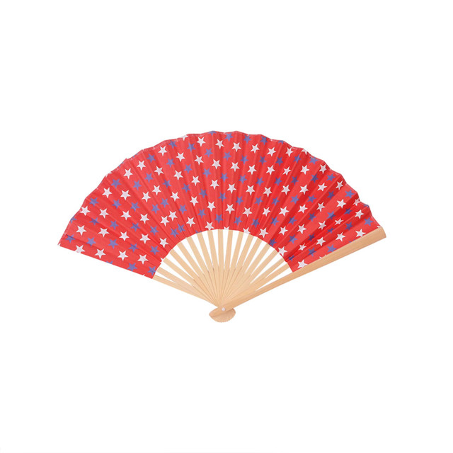 A red foldable fan featuring white stars, with a wooden handle. It has a decorative pattern and a minimalist design.