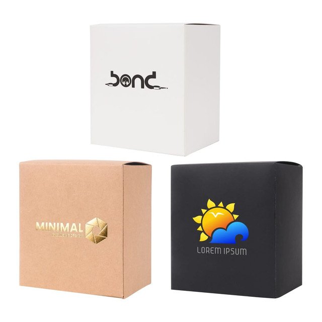 Three medium square gift boxes in white, brown, and black, each featuring different logos on the front.