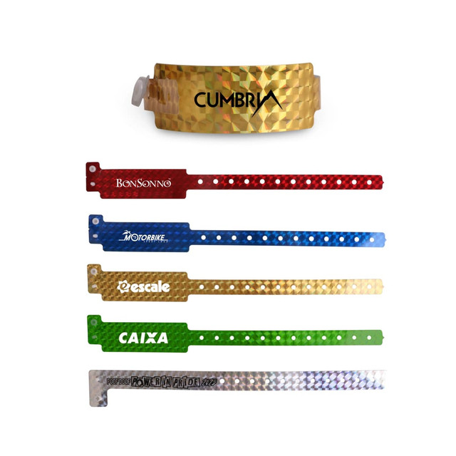 A collection of disposable holographic PVC wristbands in gold, red, blue, green, and silver, featuring assorted branding.
