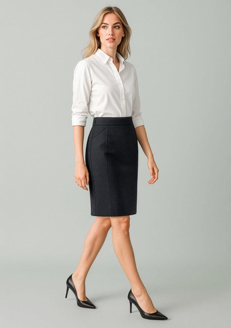 A fitted women's pencil skirt in dark navy, paired with a white button-up shirt and black heels.