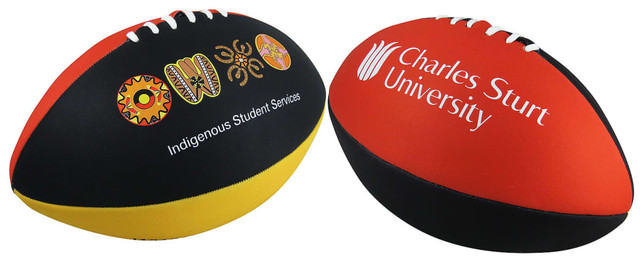 A large football featuring red, black, and yellow panels, with logos and decorative prints.