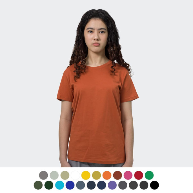 A woman wearing an orange TRENDSWEAR Original Women's T-Shirt. Various colour options displayed below.