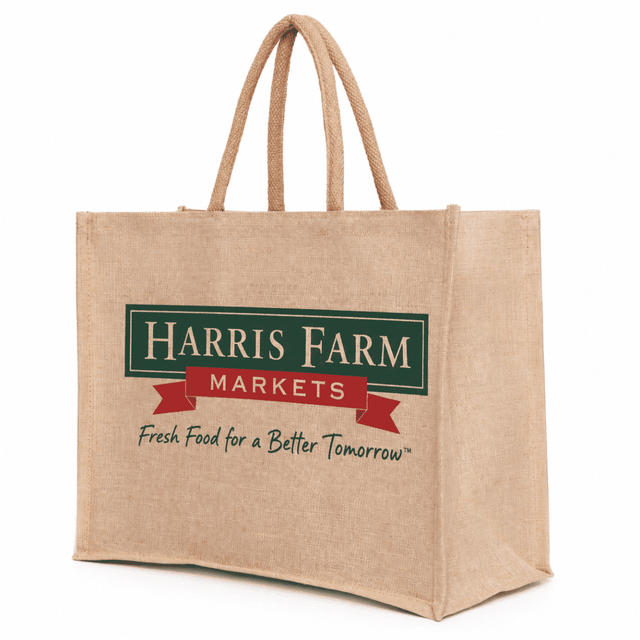 A tan Juco bag with a large logo, featuring sturdy handles for easy carrying.