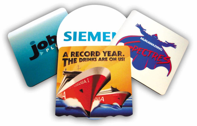 Four coasters featuring various designs, including vibrant colours and branding logos. Four coasters featuring various designs, including vibrant colours and branding logos.