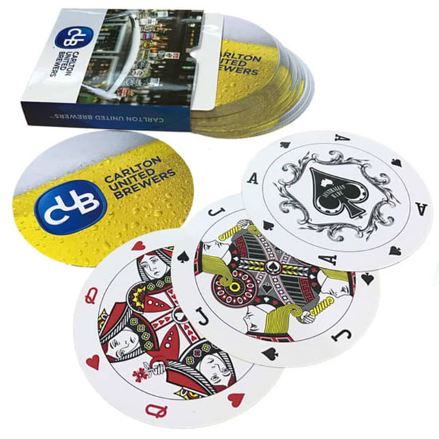 Round shaped playing cards in white featuring various designs, accompanied by a branded box with a logo. Round shaped playing cards in white featuring various designs, accompanied by a branded box with a logo.