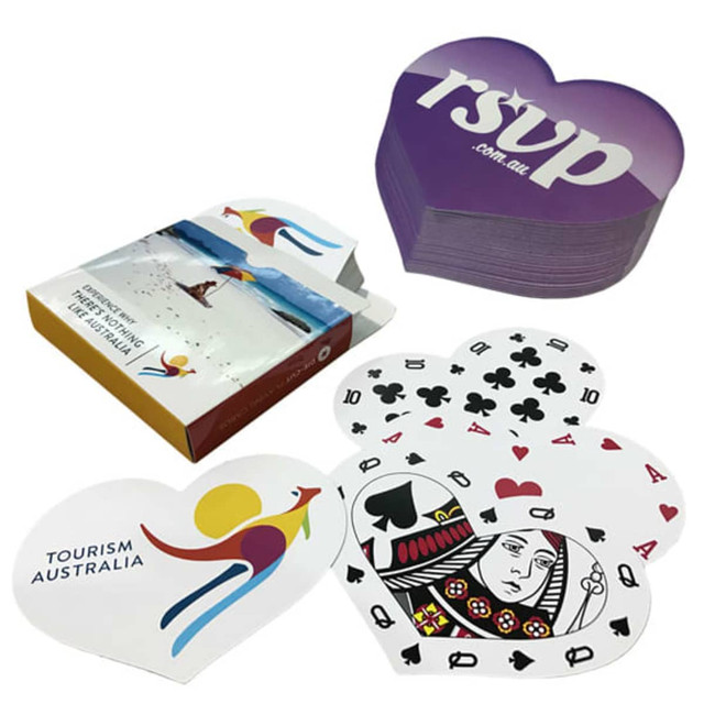 Heart-shaped playing cards in red and black designs, with a matching heart-shaped box featuring a logo. Heart-shaped playing cards in red and black designs, with a matching heart-shaped box featuring a logo.