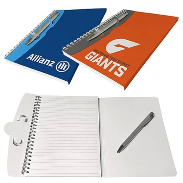 Two-tone A5 notebooks in blue and orange, featuring spiral bindings and lined pages with a pen included. Two-tone A5 notebooks in blue and orange, featuring spiral bindings and lined pages with a pen included.