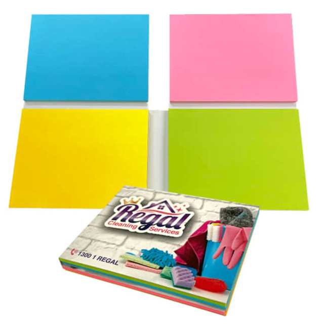 A combination of sticky note pads in blue, pink, yellow, and green, alongside a branded box featuring cleaning supplies. A combination of sticky note pads in blue, pink, yellow, and green, alongside a branded box featuring cleaning supplies.