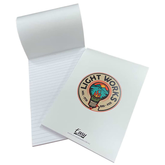 A white A5 notepad with lined pages, featuring a colourful logo on the cover and a wrap-over design.