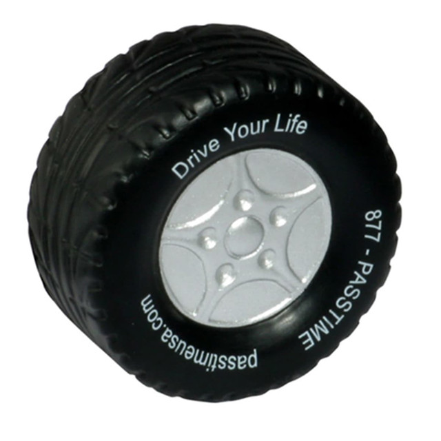 A black stress toy in the shape of a car tyre with silver detailing and a logo on the side.