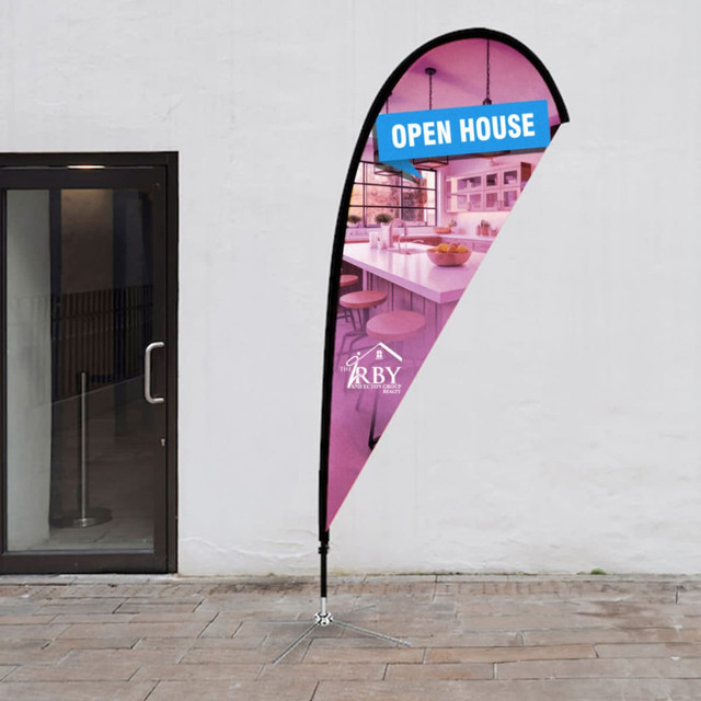 A small tear drop flag kit featuring a pink and blue design, supported by a metal base. Includes a branding logo.