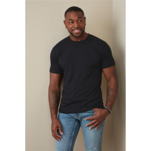 A fitted black men's T-shirt displayed on a model, paired with blue jeans. The shirt features a logo.