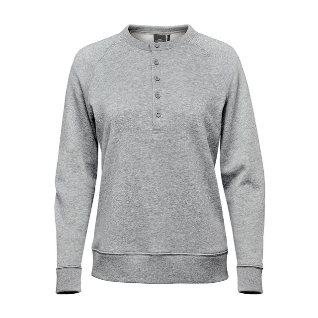 A women's grey Monashee Henley shirt featuring a button-up neck and long sleeves, with a logo on the label.