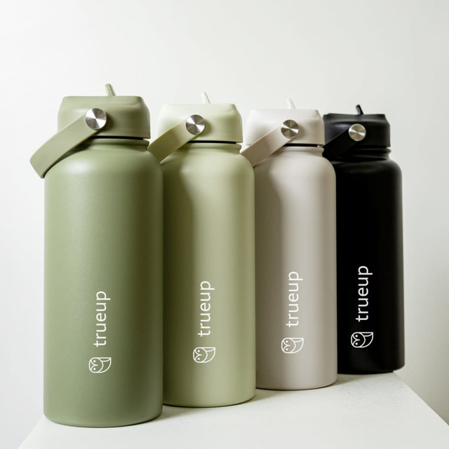 A drink bottle collection featuring four 1L bottles in olive green, cream, light grey, and black, each with a logo.