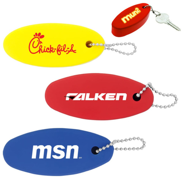 A collection of floating keychains in yellow, red, and blue, each attached to a chain, with various logos.