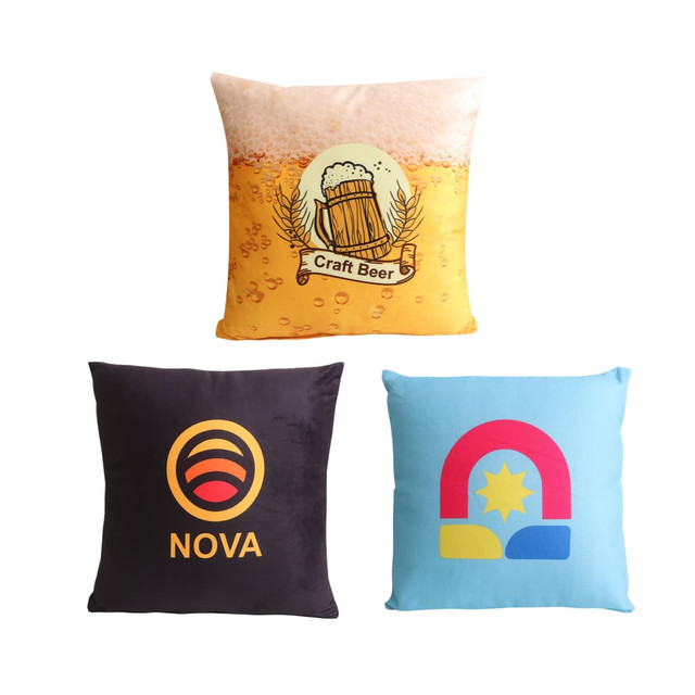 Three square cushions featuring designs: one with a beer theme, a black one with a logo, and a blue one with a colourful graphic.