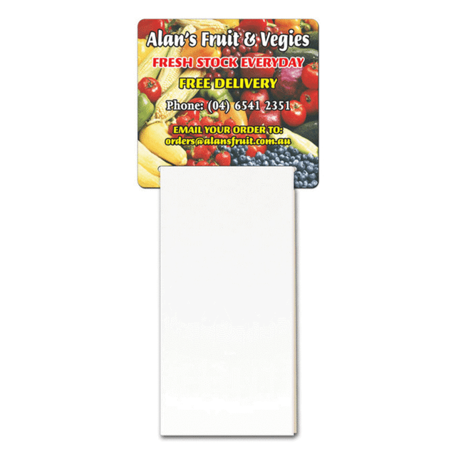 A magnetic calendar featuring a colourful fruit and vegetable design at the top and a blank notepad section below.