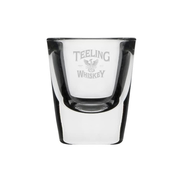 A clear glass shot glass with a logo, featuring a classic design and a smooth finish.