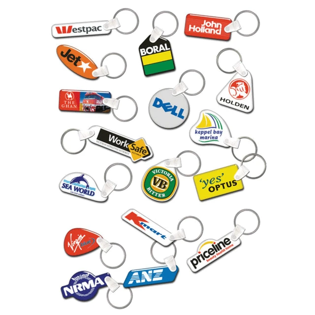 A collection of assorted keyrings in various shapes and colours, featuring several logos and branding elements.