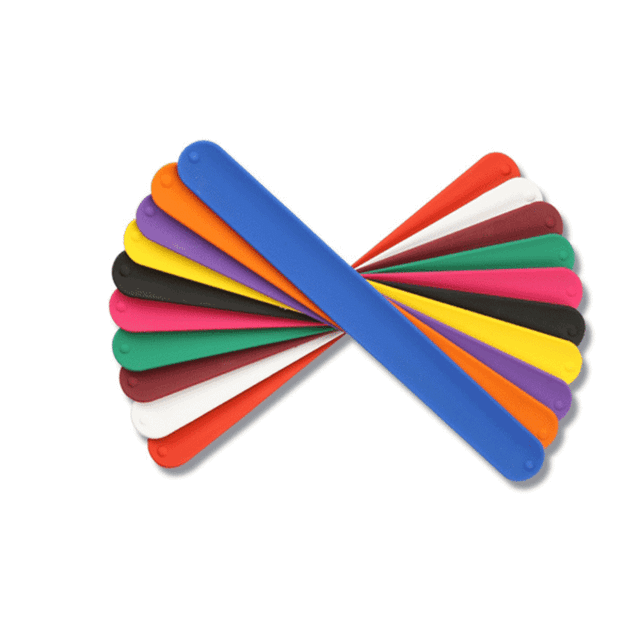 A collection of silicon slap bands in various colours, including blue, orange, black, green, pink, and white, arranged together.