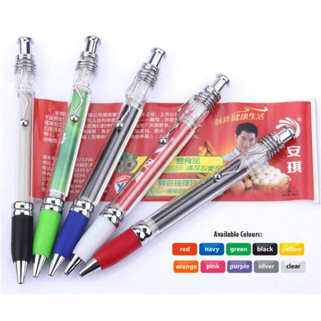 A collection of five pens in red, green, blue, black, and white, featuring a silver clip and a transparent barrel.