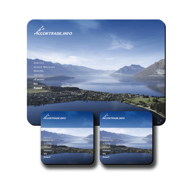 A counter mat and two coasters featuring a landscape design with blue and green hues, including a logo.