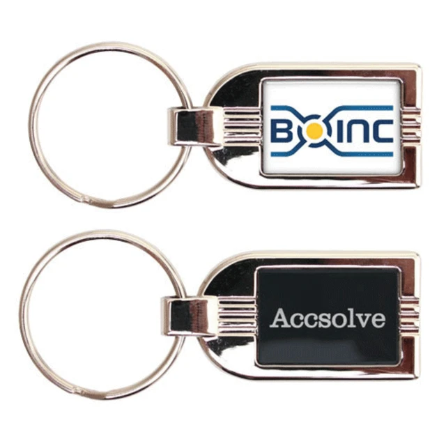 A silver metal keyring featuring two sides, one with a logo and the other in a black finish.