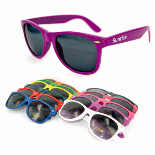 Fashion sunglasses in various colours, including purple, red, green, and blue, arranged in a stack with one pair prominently displayed.