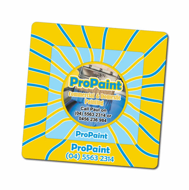 A square magnetic photo frame featuring a circular centre with a logo, set against a bright yellow and blue swirled background.