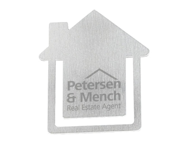 A metallic business card holder shaped like a house with a logo and branding on the surface.
