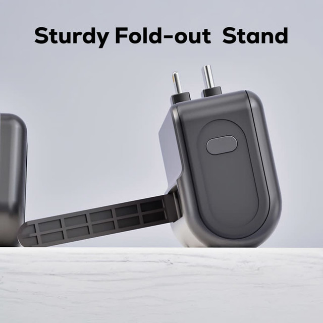A black power bank with a sturdy fold-out stand and USB port, designed for convenience and portability.