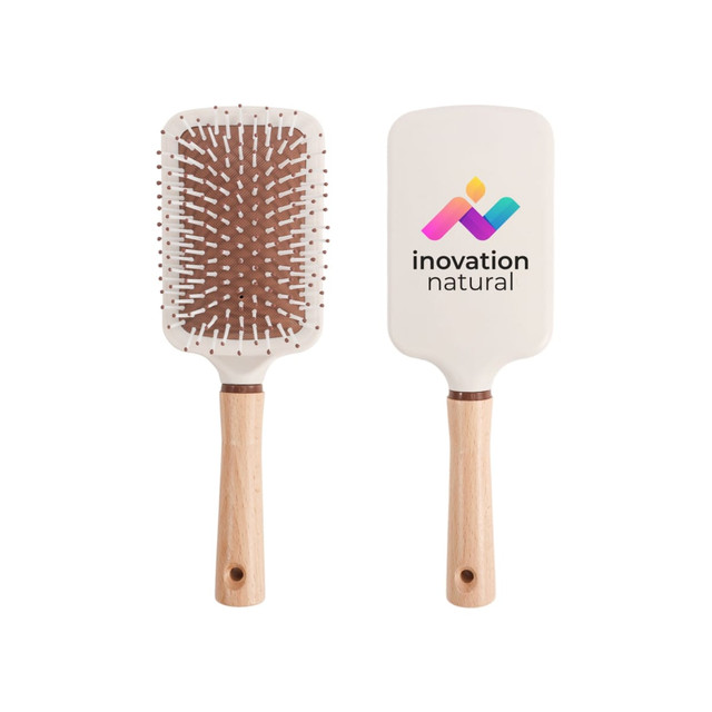 A paddle brush with a white head, wooden handle, and a logo on one side. Features brown bristles and white pins.
